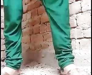 Desi woman urinating in area and wash coochie after urinating