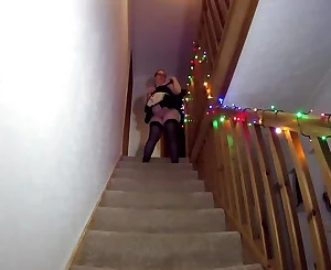 Maid cleaning the stairs in tights